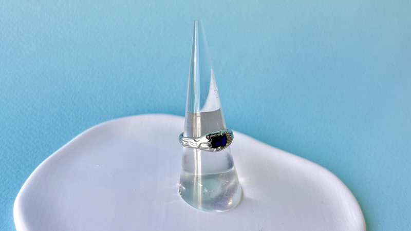 Silver ring with blue zircon-null