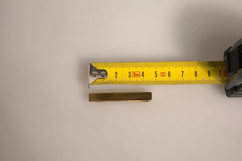 Gold tone brass logo branded tie clip bar-null