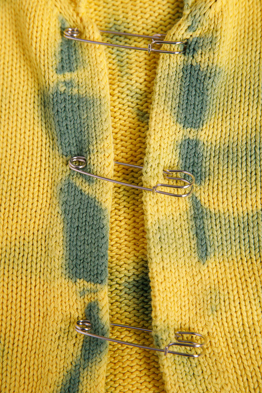 Cardigan with safety pins-null