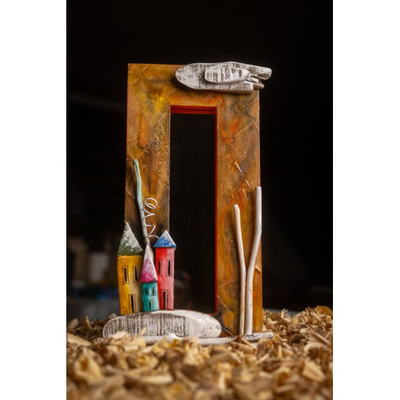 Colored vertical wooden mirror with houses orange