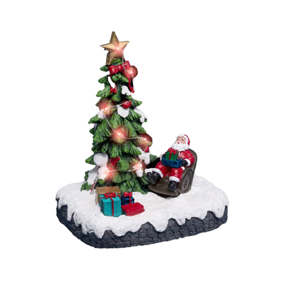 Saint claus beside a decorated christmas tree, , medium